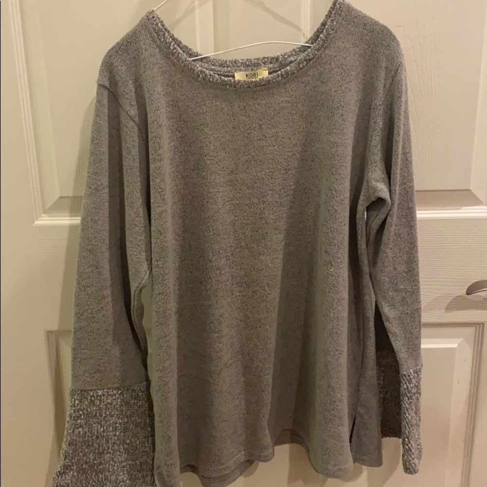 Gray sweater with lighter sleeves